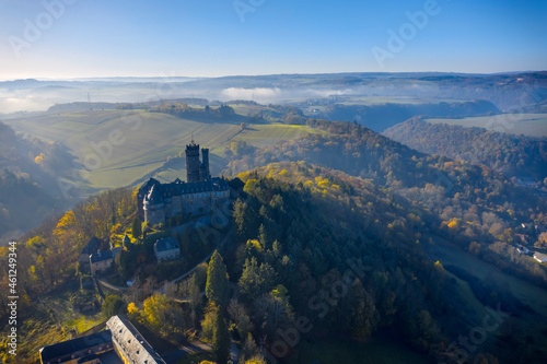 Bird's eye view of Schaumburg Castle near Balduinstein / Germany in autumn with backlight