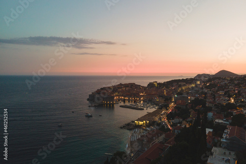 Fototapeta Naklejka Na Ścianę i Meble -  Travel to Croatia. Aerial night image of summer sky. Popular tourist destination in Hrvatska, Dubrovnik has hundreds of tourists to take pictures of the medieval fortification that has become iconic