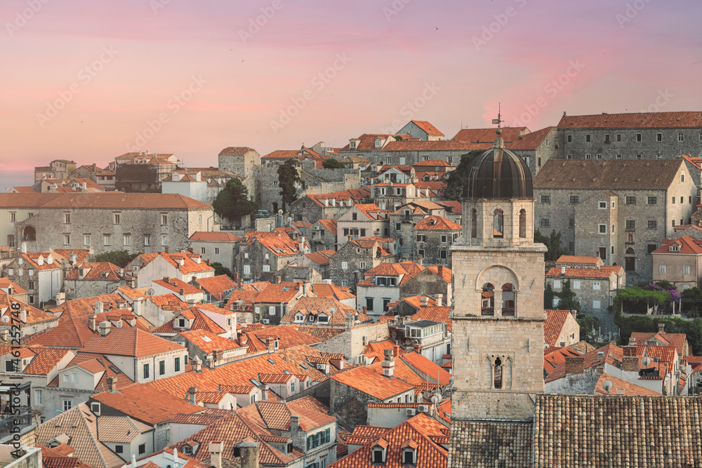 Dubrovnik Clock Tower at sunset amazing sky and sunt light. Bell Tower in Luza Square. It's also known as Susak Bell Tower built in the 14th century. Travel to Dubrovnik, Croatia. - obrazy, fototapety, plakaty 