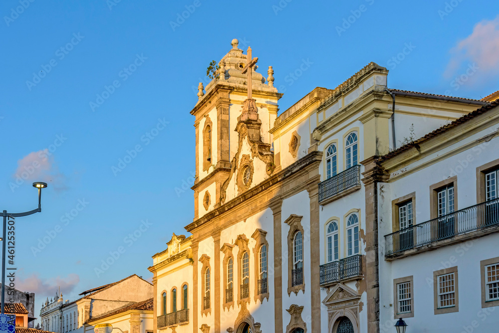 Facade of an old and historic church from the 18th century in the central square of the Pelourinho district in the city of Salvador, Bahia lighting by the sunset