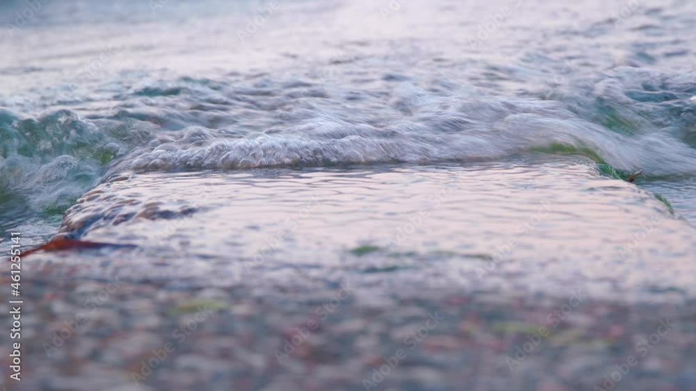 closeup of water flow on a rock