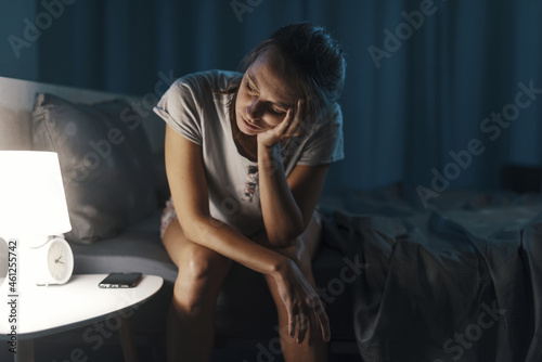 Exhausted woman suffering from insomnia photo