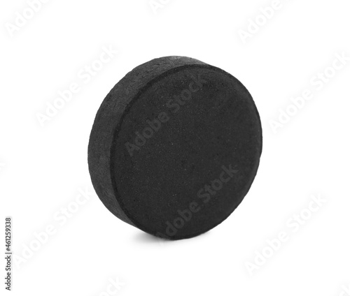 Activated charcoal pill isolated on white. Potent sorbent