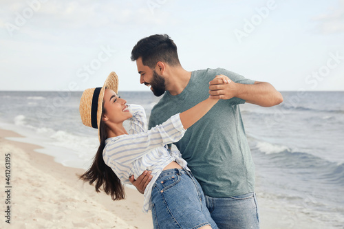 Lovely couple dancing on beach. Time together © New Africa