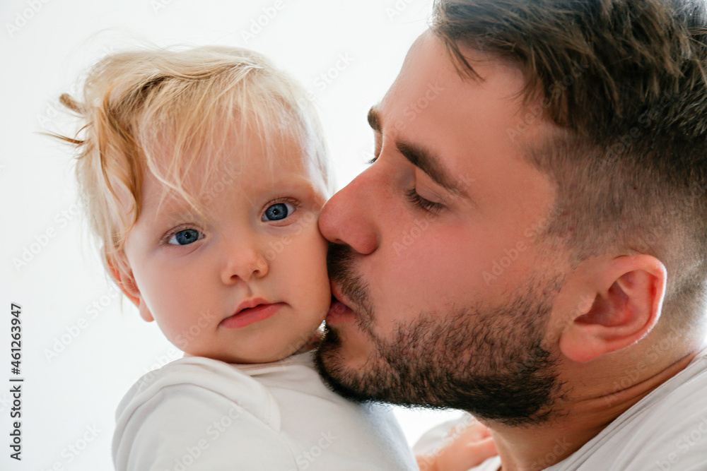Father and daughter spending quality time together. Bearded man with his adorable blonde toddler. Close up, copy space for text, background. Father and daughter spending quality time together. Bearded man with his adorable blonde toddler. Close up, copy space for text, background.