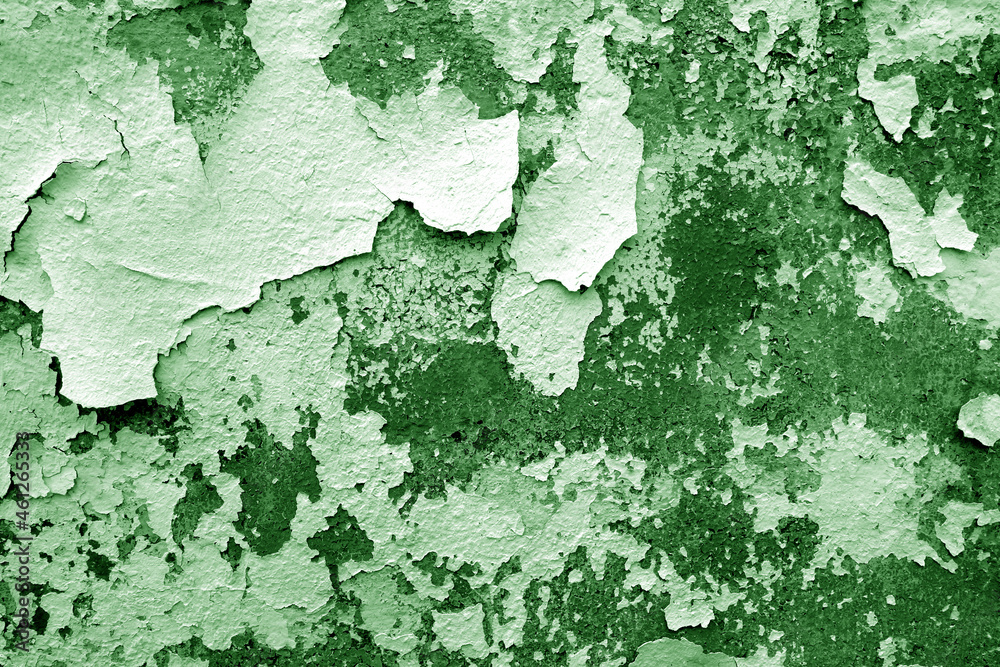 Obraz premium Сement wall with peeling paint and plaster in green tone.