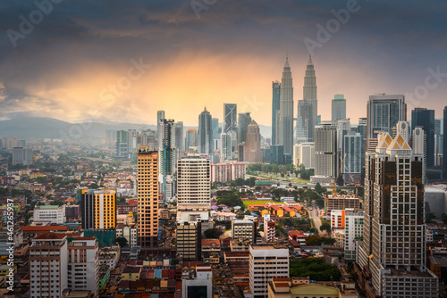 Panorama view of Kuala Lumpur business distric skyscraper with colorful sunrise sky background, Malaysia.