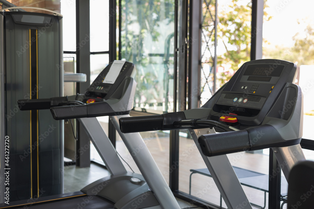 Indoor modern sport club has treadmill and weight training equipment. Fitness places for cardio runner and athlete. Exercise good healthy Indoor modern sport club has treadmill and weight training equipment. Fitness places for cardio runner and athlete. Exercise good healthy