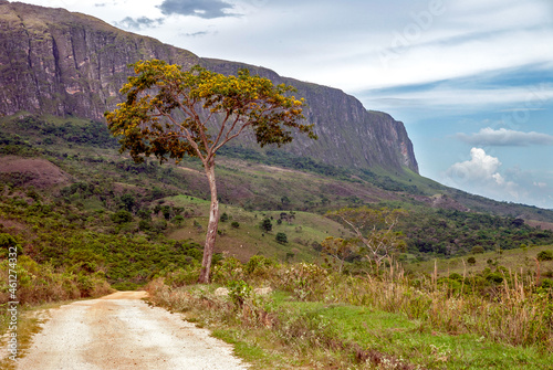 Serra da Canastra Park massif seen from a small dirt and gravel road, cloudy sky, São Roque de Minas, Minas Gerais, Brazil photo