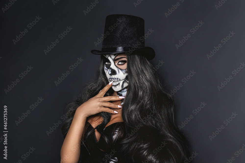 Female Model In Halloween Silence. Sexy Brunette Woman In Skull Makeup And  Latex Costume On Black Background. Halloween Costume Concept. Stock Photo |  Adobe Stock