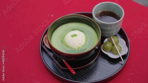 Green Tea Matcha float with Green Dango in Uji, Close Pan Shot photo