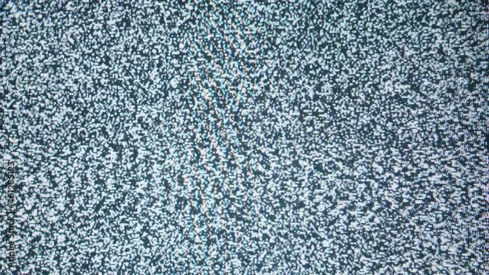 Old retro television screen with ripples, wavy flowing damaged signal. Close-up of broken old-fashioned TV with noise, bad signal reception, cinematography concept. Old retro television screen with ripples, wavy flowing damaged signal. Close-up of broken old-fashioned TV with noise, bad signal reception, cinematography concept.