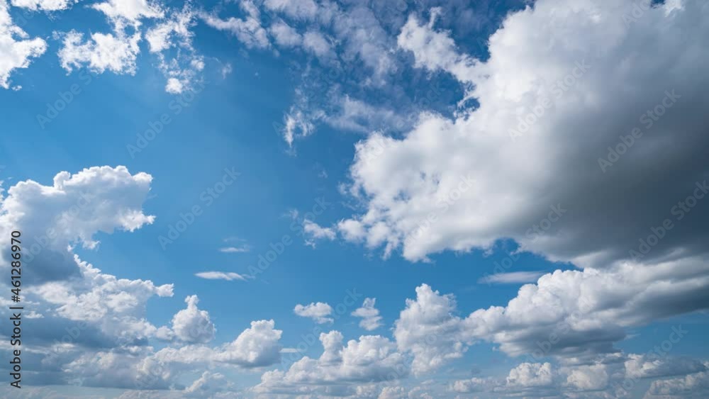 Blue sky white clouds. Puffy fluffy white clouds. Cumulus cloud cloudscape timelapse. Summer blue sky time lapse. Nature weather blue sky. White clouds background. Cloud time lapse , video loop