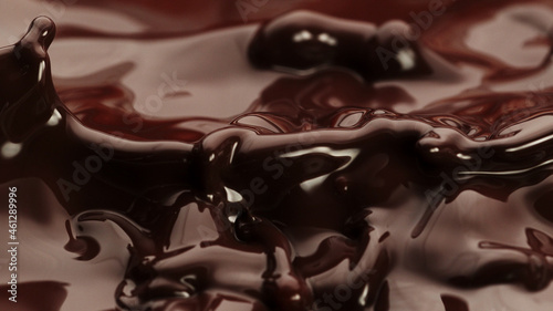 Macro photo of premium dark chocolate splashing.