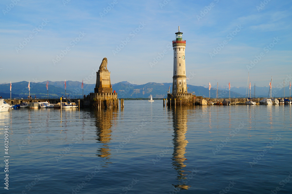 the beautiful harbour of Lindau island on lake Constance (Bodensee) with the Alps in the background, Germany on fine sunny day	
