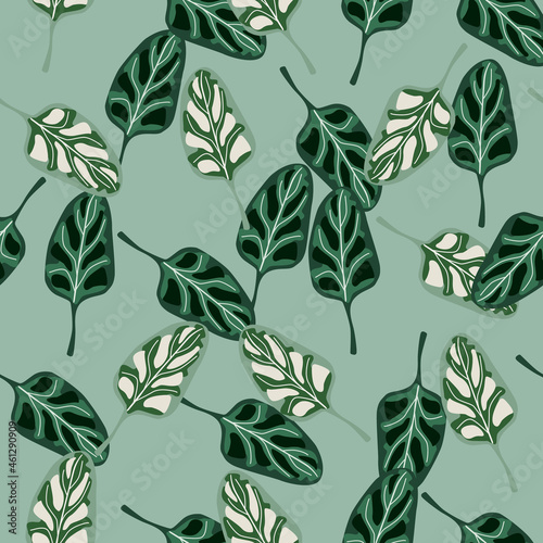 Seamless pattern Spinach salad on pastel teal background. Abstract ornament with lettuce.