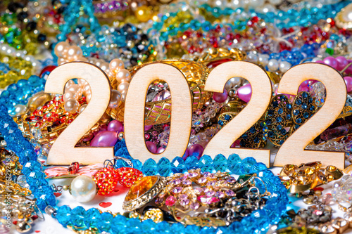 number 2022 on a background of colorful and shiny jewelry  selective focus  closeup