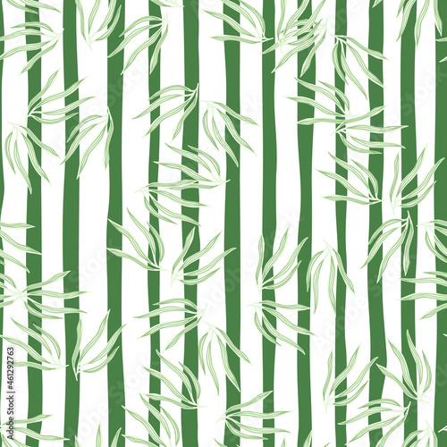 Modern leaves semless pattern. Abstract tropic leaf isolated on stripe background.