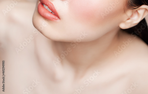 Collar bone pink lips and skin care on nude beauty makeup background