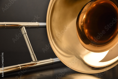 Trombone bell and slide detail front view black background photo