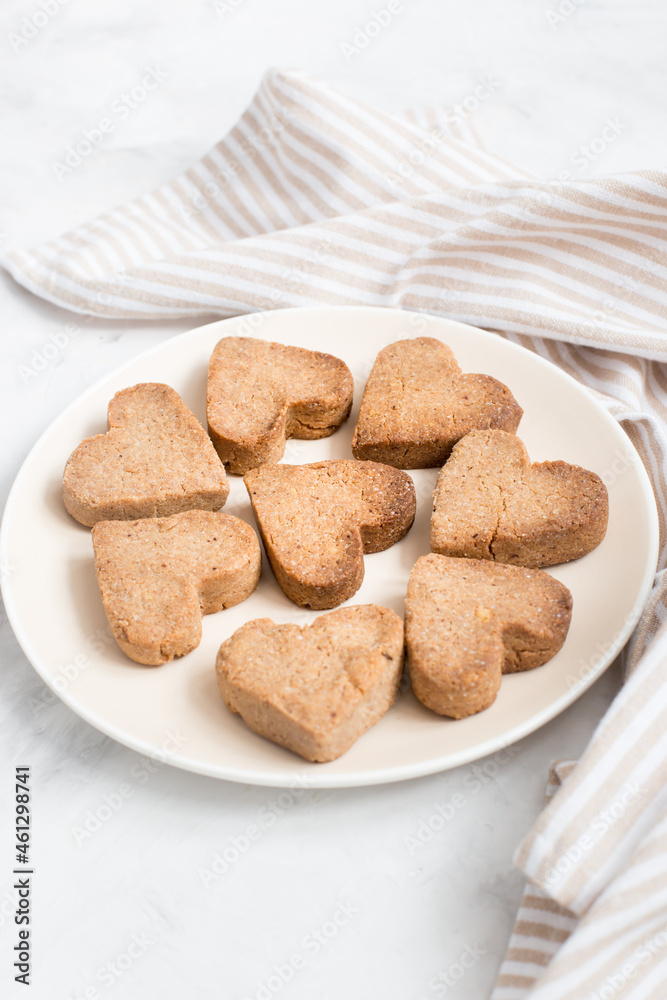 homemade heart-shaped cookies on a plate, Valentine's day gift with love, gluten-free buckwheat flour pastries. homemade heart-shaped cookies on a plate, Valentine's day gift with love, gluten-free buckwheat flour pastries.