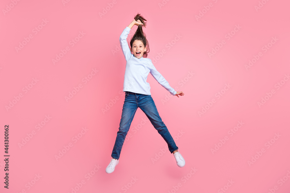 Full length body size view of pretty cheerful girl jumping having fun making tail isolated over pink pastel color background