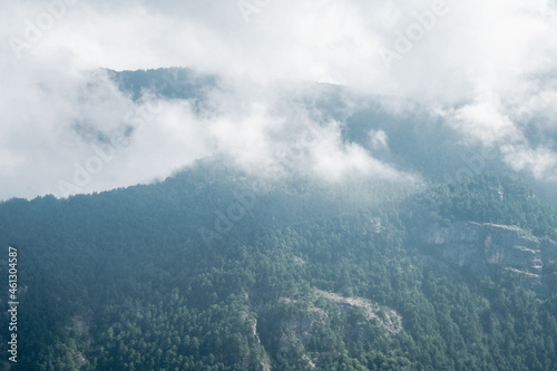 Mist in the forest up to the mountains hills .autumn landscape in Greece,Olympus