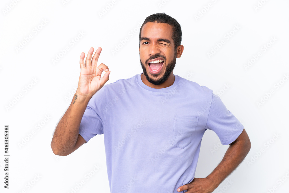 Young Ecuadorian man isolated on white background showing ok sign with fingers Young Ecuadorian man isolated on white background showing ok sign with fingers