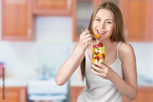 Young woman eat salad. Home concept. Healthy lifestyle concept.