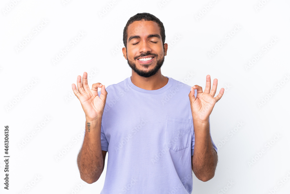 Young Ecuadorian man isolated on white background in zen pose Young Ecuadorian man isolated on white background in zen pose