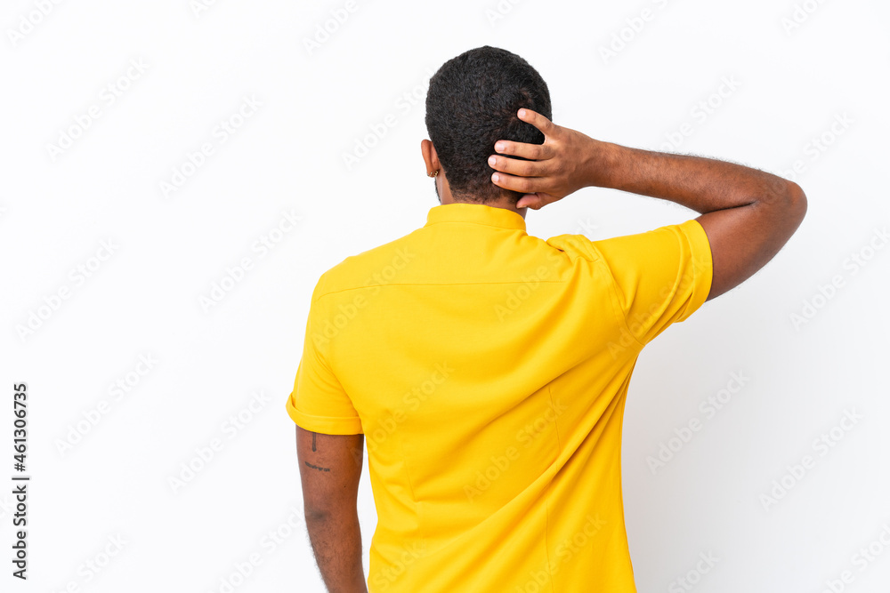 Young Ecuadorian man isolated on white background in back position and thinking