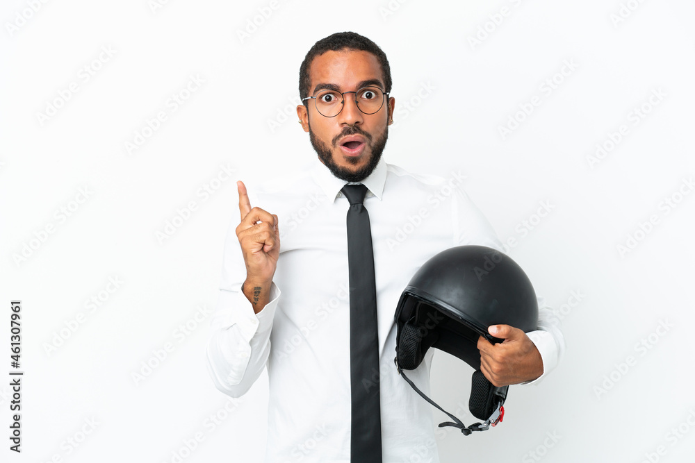 Young business latin man with a motorcycle helmet isolated on white background intending to realizes the solution while lifting a finger up Young business latin man with a motorcycle helmet isolated on white background intending to realizes the solution while lifting a finger up