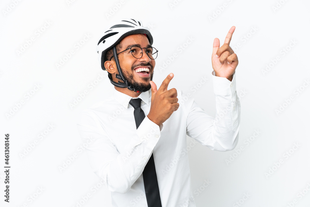 Young business latin man holding a bike helmet isolated on white background pointing with the index finger a great idea