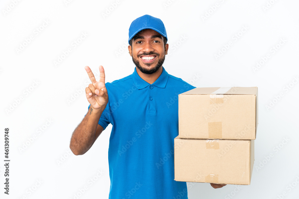 Delivery Ecuadorian man isolated on white background smiling and showing victory sign Delivery Ecuadorian man isolated on white background smiling and showing victory sign