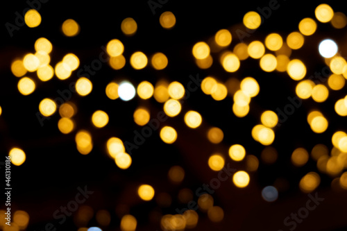 Bokeh golden lights. Beautiful Christmas or romantic background. Banner. Copy space
