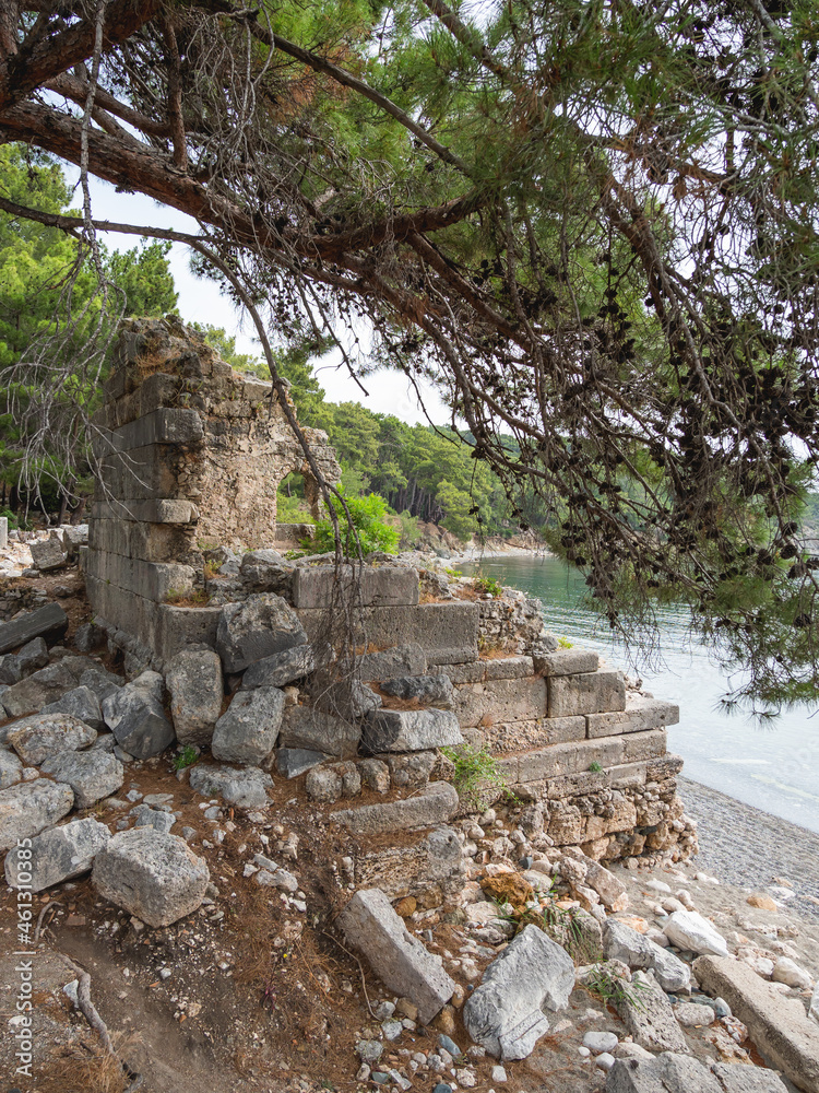 Ancient cemetery. Ruins of Phaselis city in North harbour. Famous architectural landmark. Turkey. Ancient cemetery. Ruins of Phaselis city in North harbour. Famous architectural landmark. Turkey.