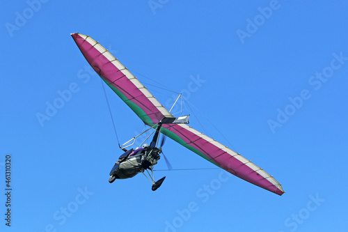 Valokuva Ultralight airplane flying in a blue sky