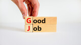 GJ good job abbreviation symbol. Concept words 'GJ good job' on wooden blocks on white table, white background, copy space. Businessman hand. Business and GJ good job concept.