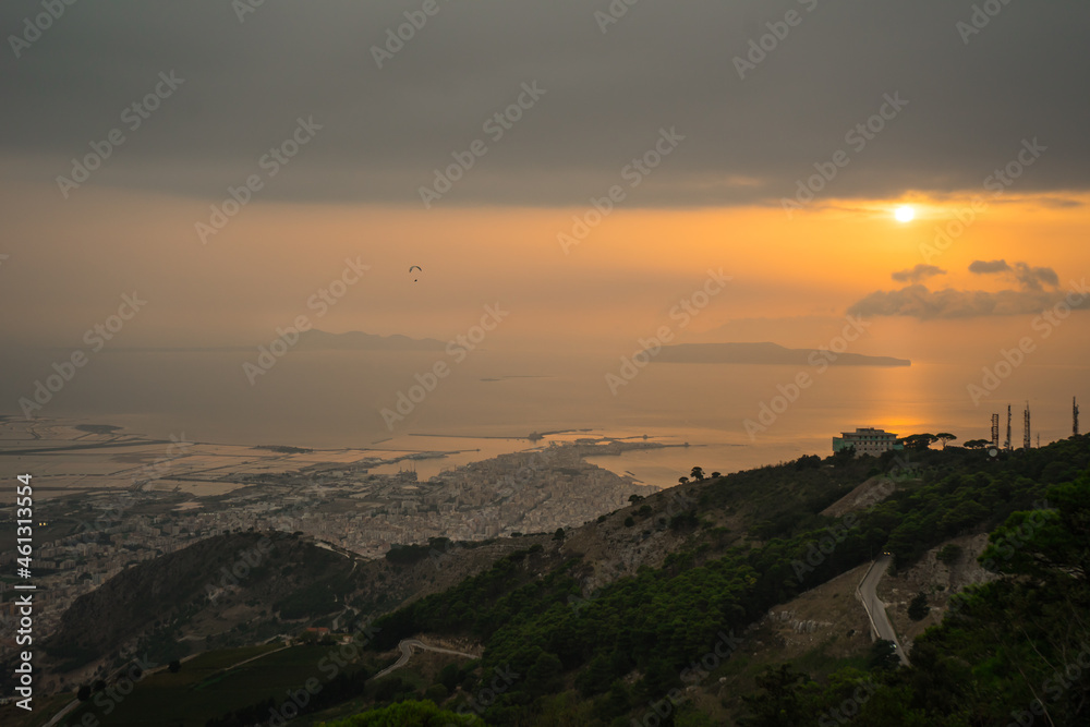 Trapani city and salt flats seaview at the sunset on a cloudy day, Sicily, Italy