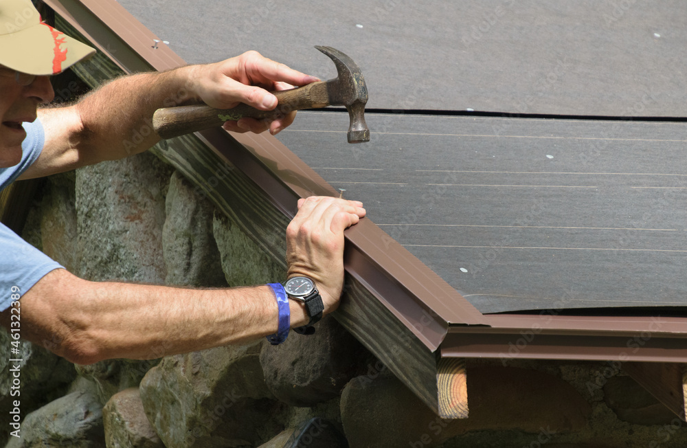 Installing a drip edge over roof felt on a new roof Stock Photo | Adobe  Stock