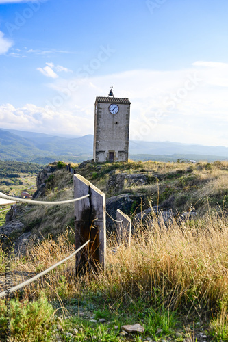 Vertical shot of a clock tower in Comarca Matarrania, Teruel province, Spain photo