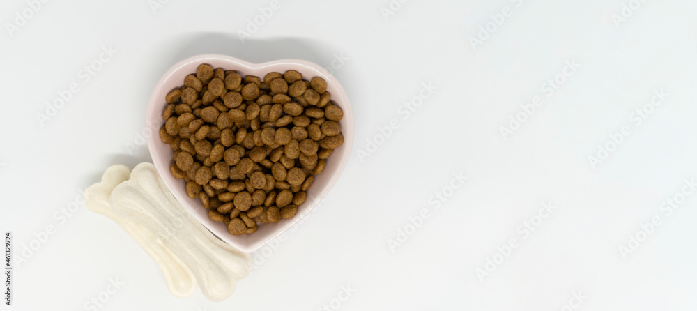 Dry dog food in a heart plate
