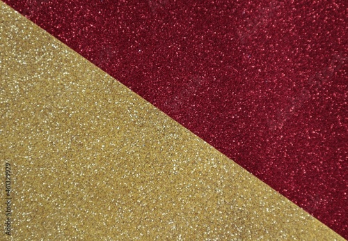 Red and yellow shiny background, divided diagonally.