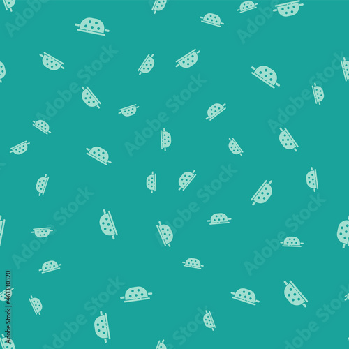 Green Kitchen colander icon isolated seamless pattern on green background. Cooking utensil. Cutlery sign. Vector