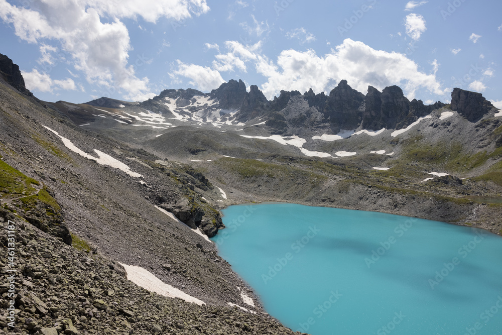 Obraz premium Amazing hiking day in one of the most beautiful area in Switzerland called Pizol in the canton of Saint Gallen. What a wonderful alpine lake called Wildsee in the Swiss alps.