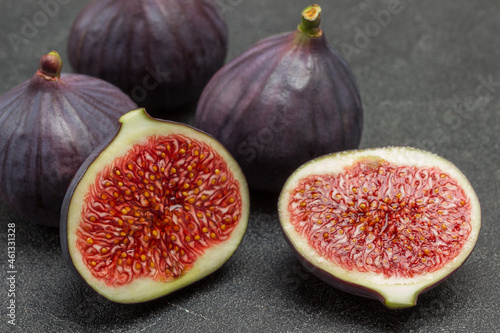 Two halves of  fig. Three whole figs