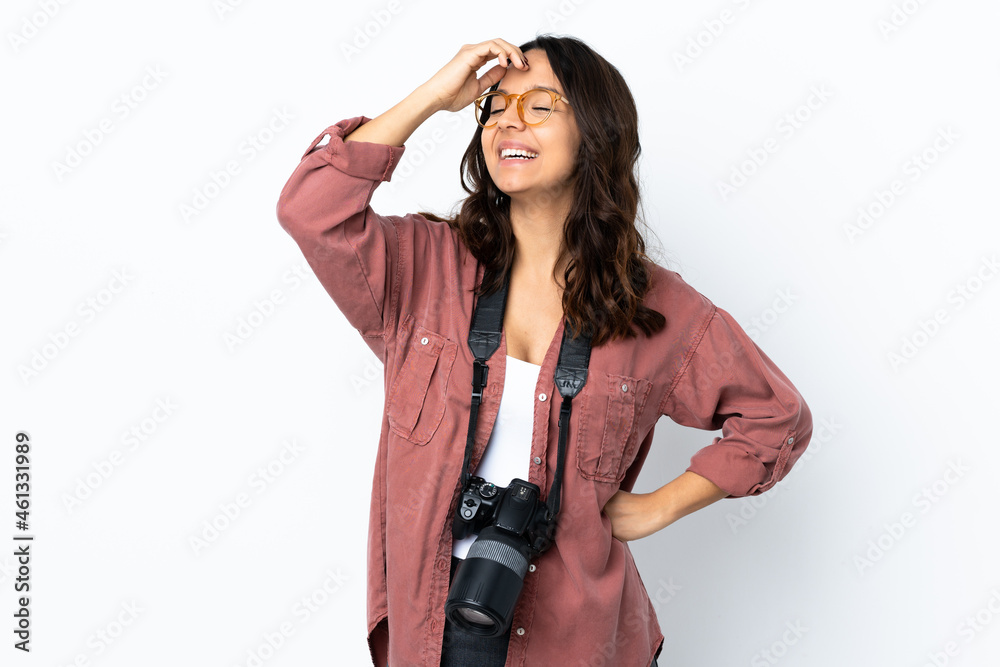 Young photographer woman over isolated white background smiling a lot