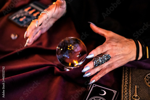 female magician reading future in a crystal ball