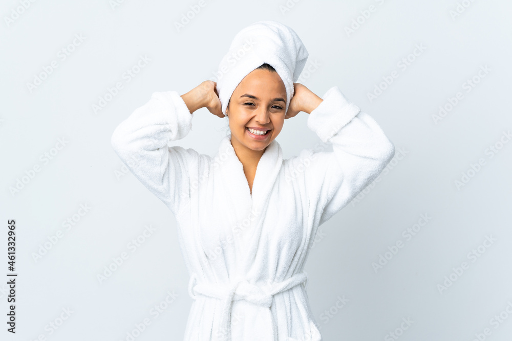 Young woman in bathrobe over isolated white background laughing Young woman in bathrobe over isolated white background laughing