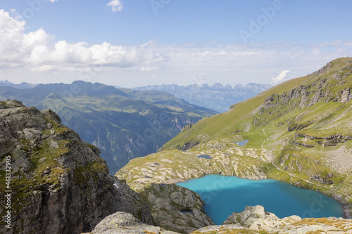 Fototapeta Naklejka Na Ścianę i Meble -  Amazing hiking day in one of the most beautiful area in Switzerland called Pizol in the canton of Saint Gallen. What a wonderful view to a clear blue alpine lake called Schottensee.